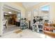 Bright sunroom with lots of natural light and ample storage space leading to kitchen at 545 Goldfinch Way, Stockbridge, GA 30281
