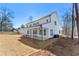 Large private backyard features a covered patio ideal for outdoor living and entertaining at 6091 Wayfarer Dr, Villa Rica, GA 30180