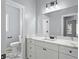 Bathroom featuring marble counters, under-sink cabinets, and modern fixtures at 6091 Wayfarer Dr, Villa Rica, GA 30180