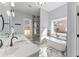 A luxurious bathroom features a double sink vanity, freestanding tub, and separate shower with elegant marble accents at 6091 Wayfarer Dr, Villa Rica, GA 30180