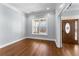 Bright entryway with hardwood floors, large window view and a stained glass front door at 6091 Wayfarer Dr, Villa Rica, GA 30180