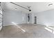 A spacious garage with high ceilings and an automatic door offers ample parking and storage at 6091 Wayfarer Dr, Villa Rica, GA 30180