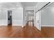 Open-concept living area featuring hardwood floors, white trim, recessed lights and a barn door at 6091 Wayfarer Dr, Villa Rica, GA 30180