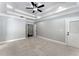 Spacious main bedroom featuring tray ceilings and recessed lights provides ample space for relaxation at 6091 Wayfarer Dr, Villa Rica, GA 30180