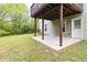Backyard featuring a door, basement access, and green grass at 7415 Marina Cv, Stone Mountain, GA 30087