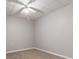 Finished basement featuring neutral carpeting, white trim and a ceiling fan at 7415 Marina Cv, Stone Mountain, GA 30087