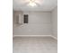 Unfinished basement with tile floor, drop ceiling, and a utility access panel at 7415 Marina Cv, Stone Mountain, GA 30087