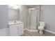 Bathroom with vanity, toilet and shower with glass enclosure at 7415 Marina Cv, Stone Mountain, GA 30087