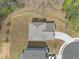 Aerial view of a well-maintained house with lush green lawn and a driveway at 1037 Devon Dr, Acworth, GA 30102