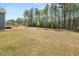 Expansive backyard offers plenty of space for outdoor activities and features mature trees at 1037 Devon Dr, Acworth, GA 30102