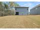 Image of backyard showing home's exterior and spacious grassy area at 1037 Devon Dr, Acworth, GA 30102