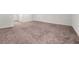Expansive basement area featuring neutral carpet, white walls, and multiple access doors for added functionality at 1037 Devon Dr, Acworth, GA 30102