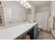 Stylish bathroom with gray vanity, white countertop, decorative mirror lighting, and patterned shower curtain at 1037 Devon Dr, Acworth, GA 30102