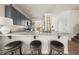 Stylish kitchen bar with stools, granite countertops, and modern appliances, perfect for casual dining and entertaining at 1037 Devon Dr, Acworth, GA 30102
