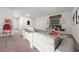 Inviting living room features comfortable seating, entertainment center, and a fun popcorn machine for movie nights at 1037 Devon Dr, Acworth, GA 30102