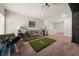 Large living room area with a golf simulator, cozy furniture, and open layout at 1037 Devon Dr, Acworth, GA 30102