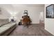 Comfortable living room featuring a sofa, desk, and stylish decor with carpet flooring at 1037 Devon Dr, Acworth, GA 30102