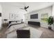 Primary bedroom with a large bed, modern furniture, and natural light at 1037 Devon Dr, Acworth, GA 30102