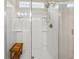 Modern shower features glass enclosure, sleek showerhead, and built-in bench, all in a bright, clean space at 1037 Devon Dr, Acworth, GA 30102