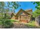Back exterior of home with fenced-in yard, pergola, and lush foliage at 1714 Parkhill Dr, Decatur, GA 30032