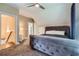 Cozy bedroom with carpet, upholstered bed, and a stairway leading to another level at 1714 Parkhill Dr, Decatur, GA 30032