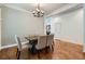Elegant dining room featuring hardwood floors, modern chandelier, and dining table with seating for six at 1714 Parkhill Dr, Decatur, GA 30032