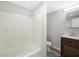 A clean bathroom with a bathtub, toilet, and vanity sink at 5955 Kemp Dr, Acworth, GA 30102