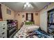Bedroom with ceiling fan, decorated with string lights, and a closet at 5955 Kemp Dr, Acworth, GA 30102
