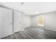 A bright bedroom with grey flooring and convenient closet space at 5955 Kemp Dr, Acworth, GA 30102