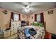 Bedroom with ceiling fan, natural light, and string lights at 5955 Kemp Dr, Acworth, GA 30102