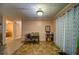 Charming dining area with tile flooring, a wooden table set, and an adjacent view into a hallway at 5955 Kemp Dr, Acworth, GA 30102