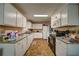 Spacious kitchen with white cabinets, granite countertops, and modern appliances at 5955 Kemp Dr, Acworth, GA 30102