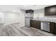 Well-lit kitchen showcases stainless steel appliances and dark wood cabinets with granite countertops at 5955 Kemp Dr, Acworth, GA 30102