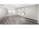 Inviting living room with wood flooring, multiple windows, and plenty of natural light at 5955 Kemp Dr, Acworth, GA 30102