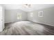 Bright main bedroom features vaulted ceiling, gray flooring, and well lit windows at 5955 Kemp Dr, Acworth, GA 30102