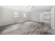 Spacious main bedroom offers a large closet, windows with backyard views, and gray flooring at 5955 Kemp Dr, Acworth, GA 30102