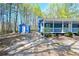 Home featuring a covered porch and shed in the yard at 5955 Kemp Dr, Acworth, GA 30102