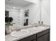 Bright bathroom showcasing double vanity, granite countertop, and bathtub with decorative black shower curtain at 89 Cowpen Ct, Covington, GA 30014