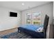 Cozy bedroom with natural light, hardwood floors, and a relaxing atmosphere at 89 Cowpen Ct, Covington, GA 30014