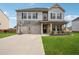 Charming two-story home with a two-car garage and well-manicured lawn at 89 Cowpen Ct, Covington, GA 30014