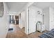 Bright hallway with hardwood floors leading to the living area and kitchen at 89 Cowpen Ct, Covington, GA 30014