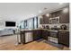 Modern kitchen with stainless steel appliances, granite countertops, and bar seating at 89 Cowpen Ct, Covington, GA 30014