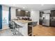 Modern kitchen with stainless steel appliances, granite countertops, and bar seating at 89 Cowpen Ct, Covington, GA 30014