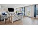 Spacious living room with hardwood floors, modern furniture, and ample natural light at 89 Cowpen Ct, Covington, GA 30014