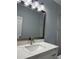 Stylish bathroom with a modern vanity, white countertop, and brushed nickel fixtures at 9450 Knollcrest Blvd, Alpharetta, GA 30022