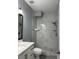 Updated bathroom featuring white tile shower and modern fixtures at 9450 Knollcrest Blvd, Alpharetta, GA 30022