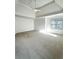 Spacious bedroom with tray ceiling, ceiling fan, and natural light from the window at 9450 Knollcrest Blvd, Alpharetta, GA 30022