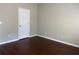 Serene bedroom featuring hardwood floors and minimalist design at 9450 Knollcrest Blvd, Alpharetta, GA 30022