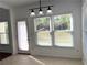 Bright breakfast nook with a door and window to the backyard at 9450 Knollcrest Blvd, Alpharetta, GA 30022
