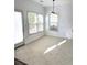 Comfortable breakfast nook illuminated by three windows and a glass door at 9450 Knollcrest Blvd, Alpharetta, GA 30022
